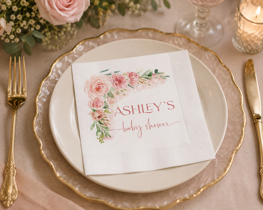 Personalized blush floral baby shower paper napkins featuring watercolor roses. Available in cocktail and luncheon sizes with matching party decor.