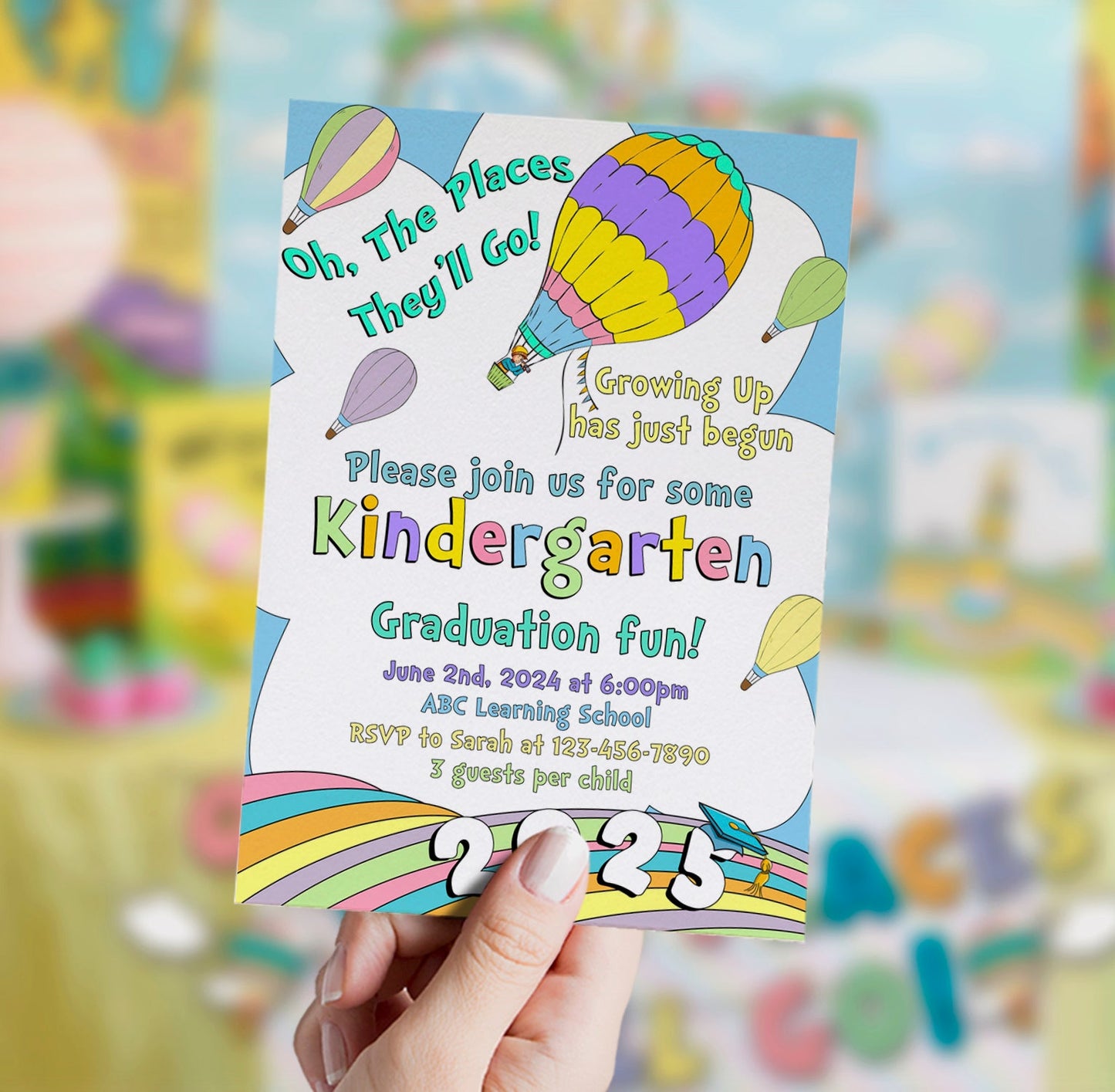 Kindergarten graduation invitation with colorful balloons held by a hand, blurred background